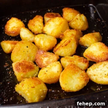 Cooked roast potatoes in a baking tray