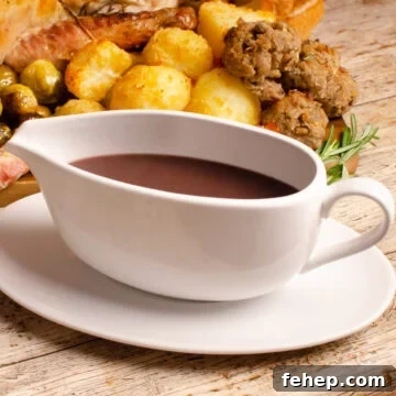 Turkey gravy in a white gravy boat