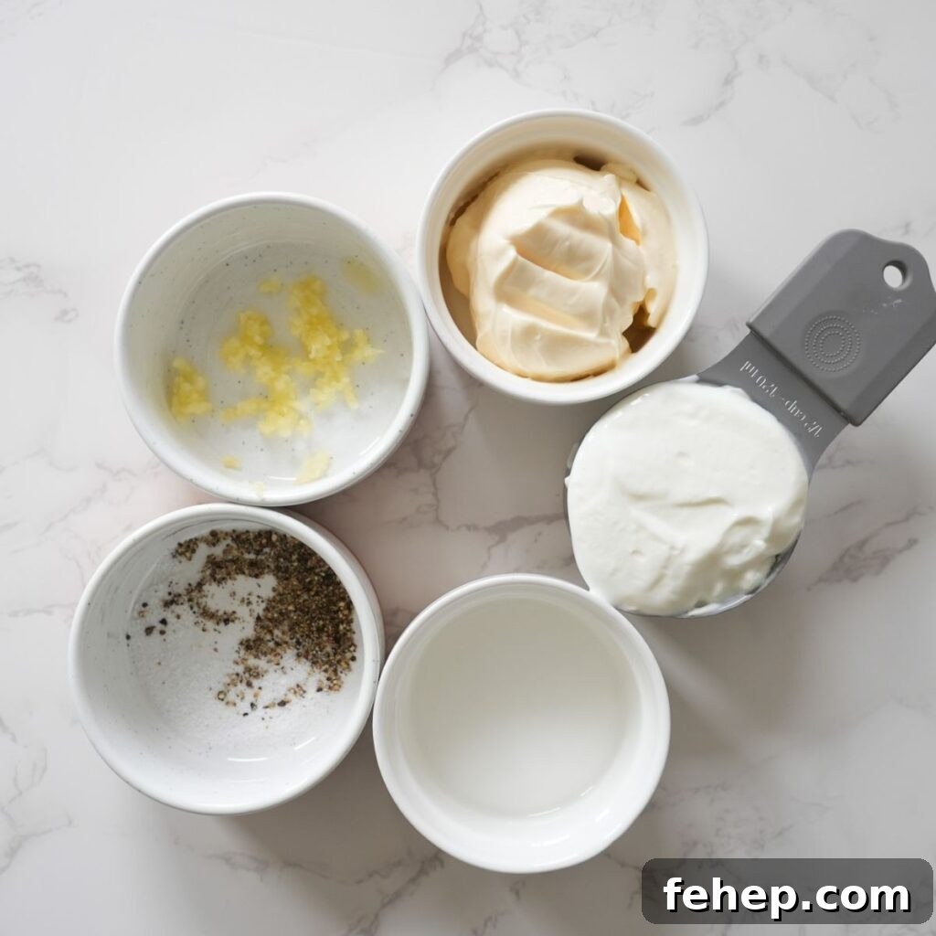 Greek yogurt, mayonnaise, minced garlic, salt, pepper and white vinegar.