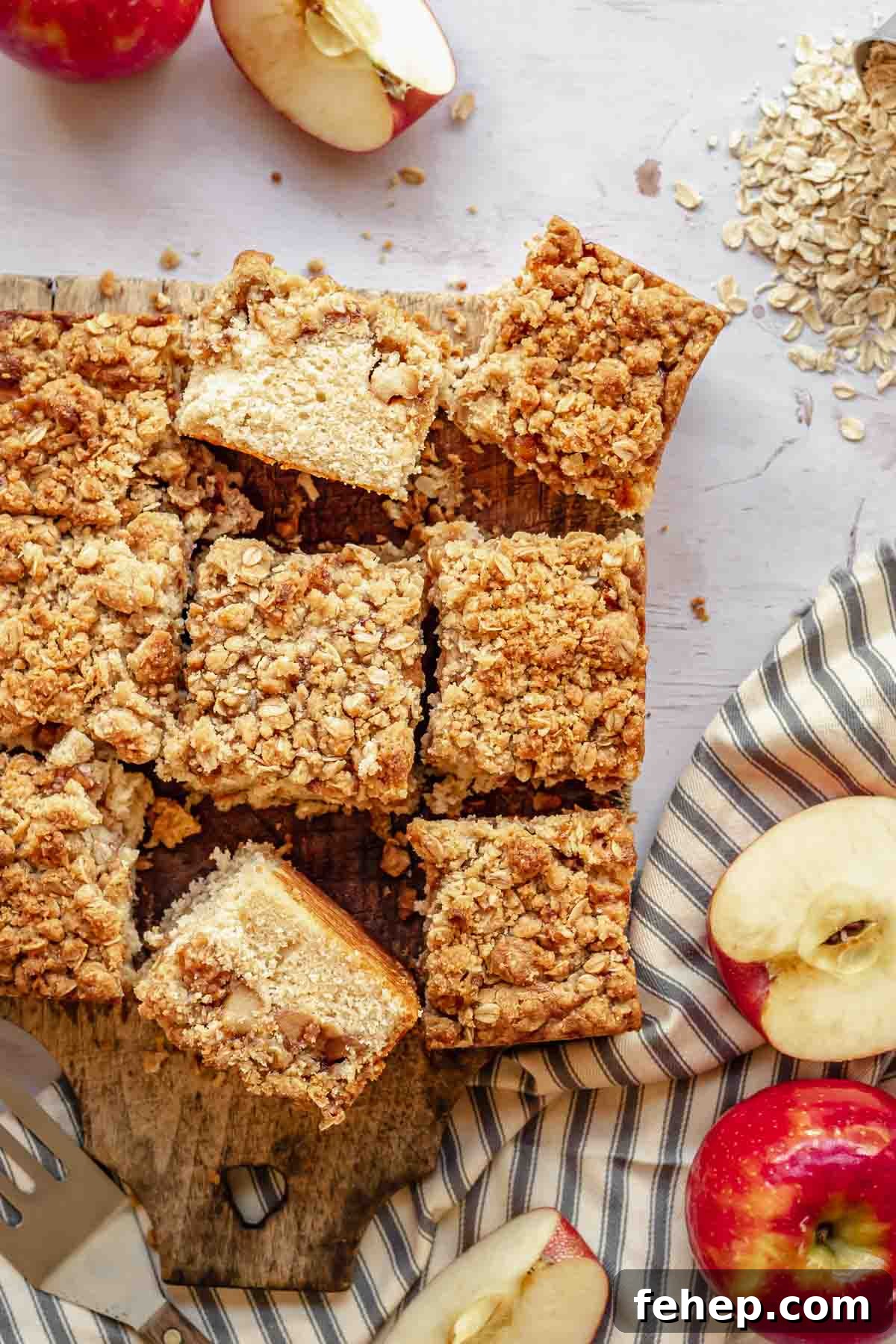 Cut slices of apple streusel coffee cake.