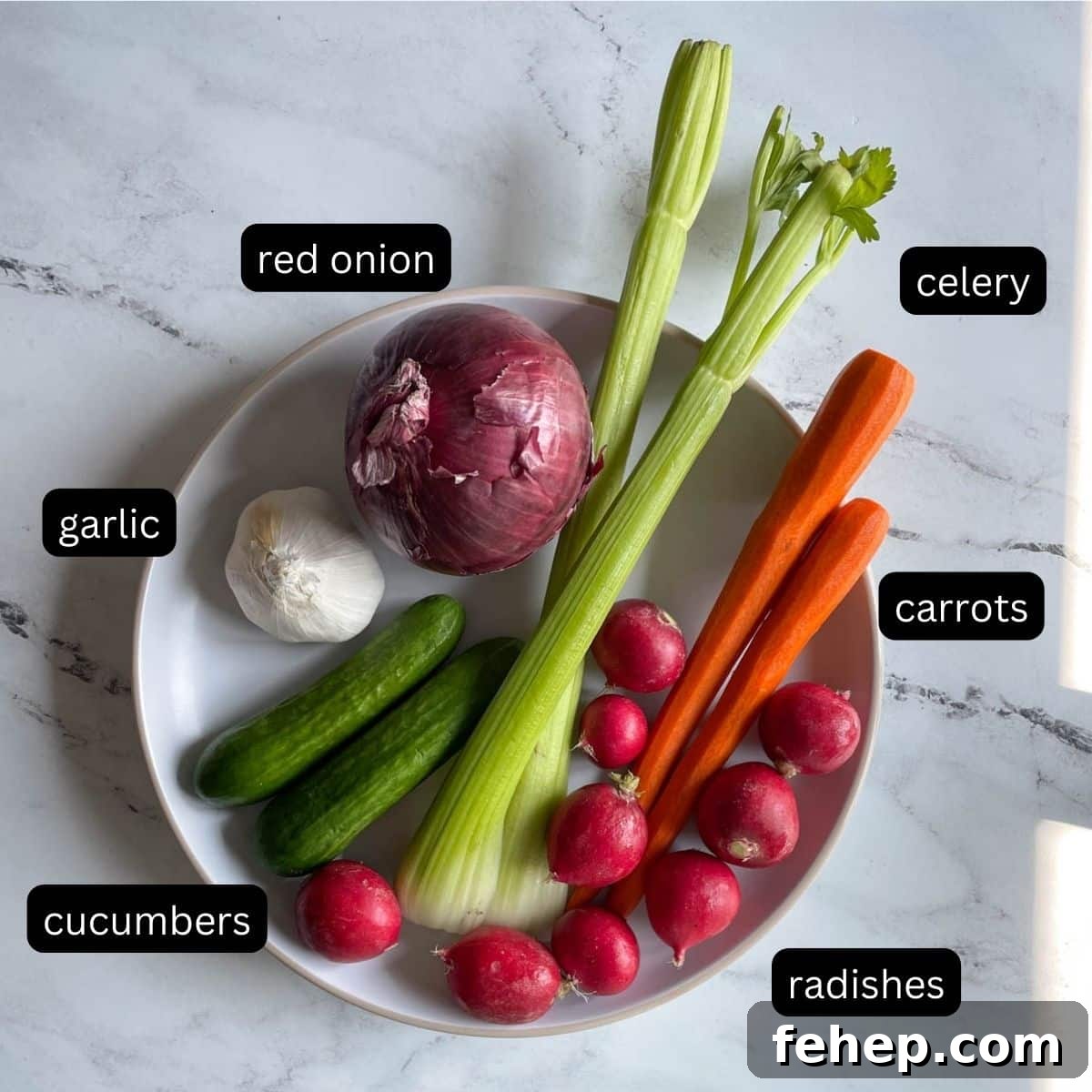 Labeled mixed vegetables are shown on a white plate.