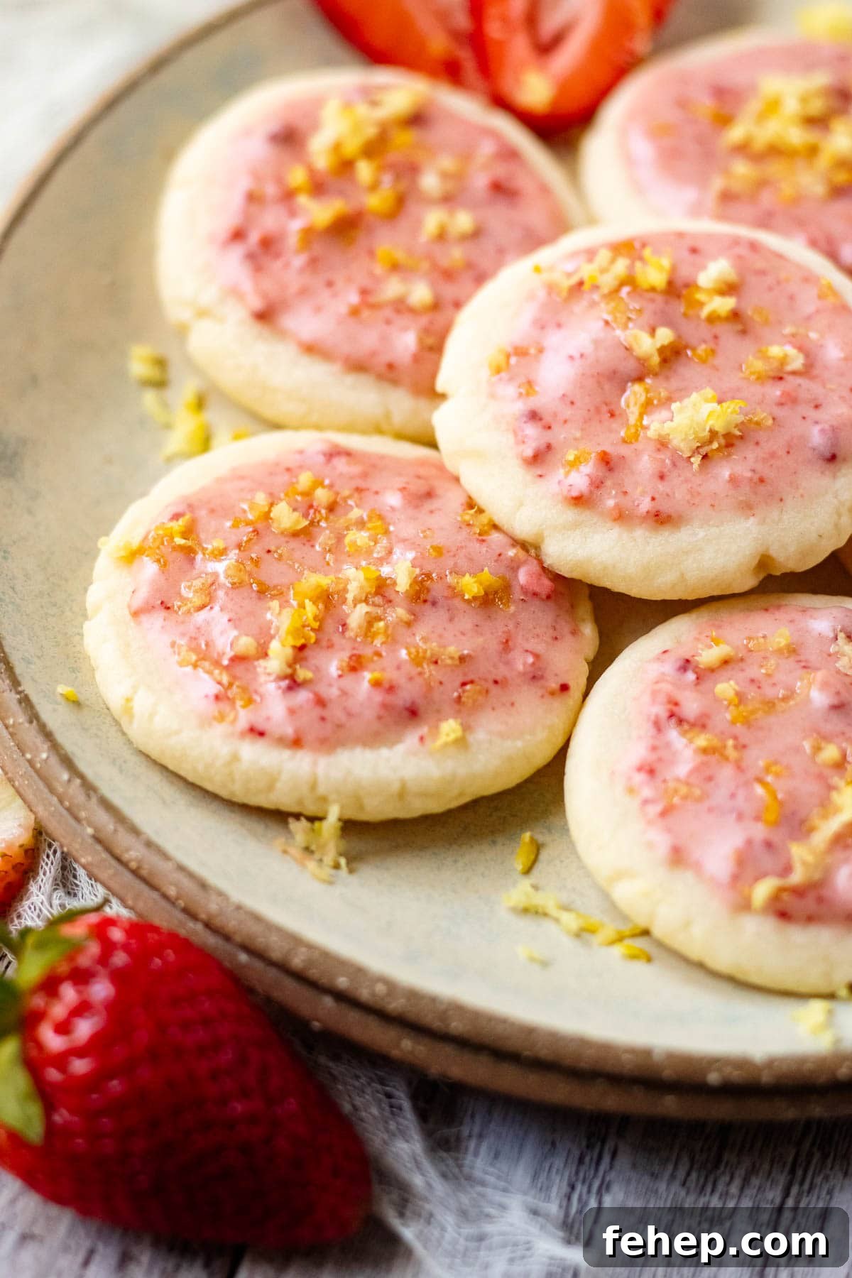 Lemon Shortbread Cookies with Strawberry Glaze Recipe 14 lemon shortbread cookies with strawberry glaze on a gray plate
