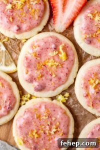 lemon shortbread cookies with strawberry glaze on parchment paper