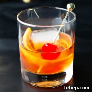 Classic Old Fashioned Cocktail Recipe: How to Make It Perfectly 9 An Old Fashioned Drink recipe served in a glass with a cherry and orange slice garnish