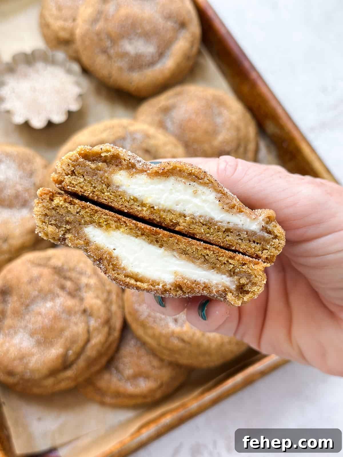 a cut cookies so you can see the cheesecake layer inside.