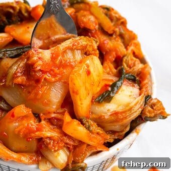 Easy Homemade Korean Kimchi Cabbage in White Bowl on White Background