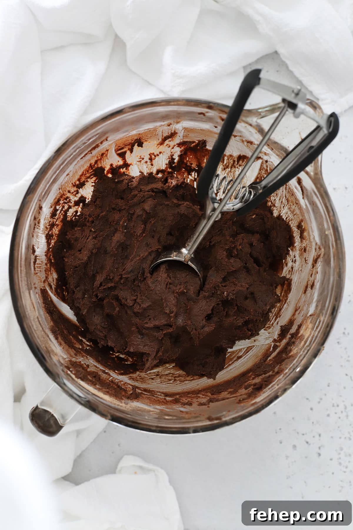 gluten-free chocolate chocolate chip cookie dough in a mixing bowl