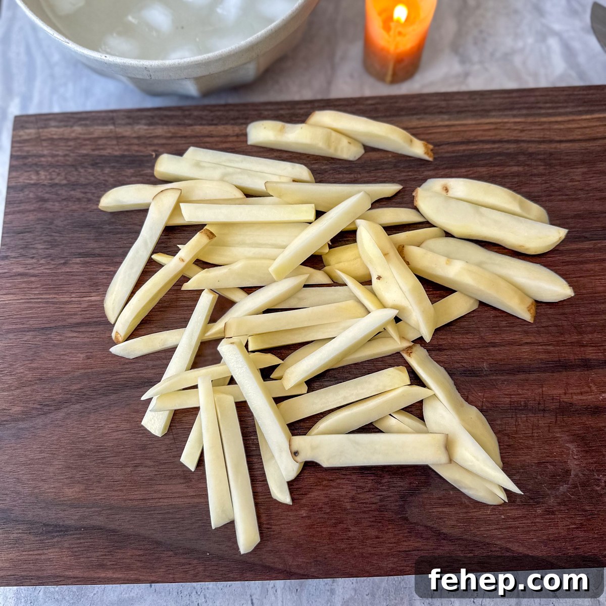 Garlic Parmesan Oven-Baked Steak Fries Recipe 4 Cut the potatoes into strips