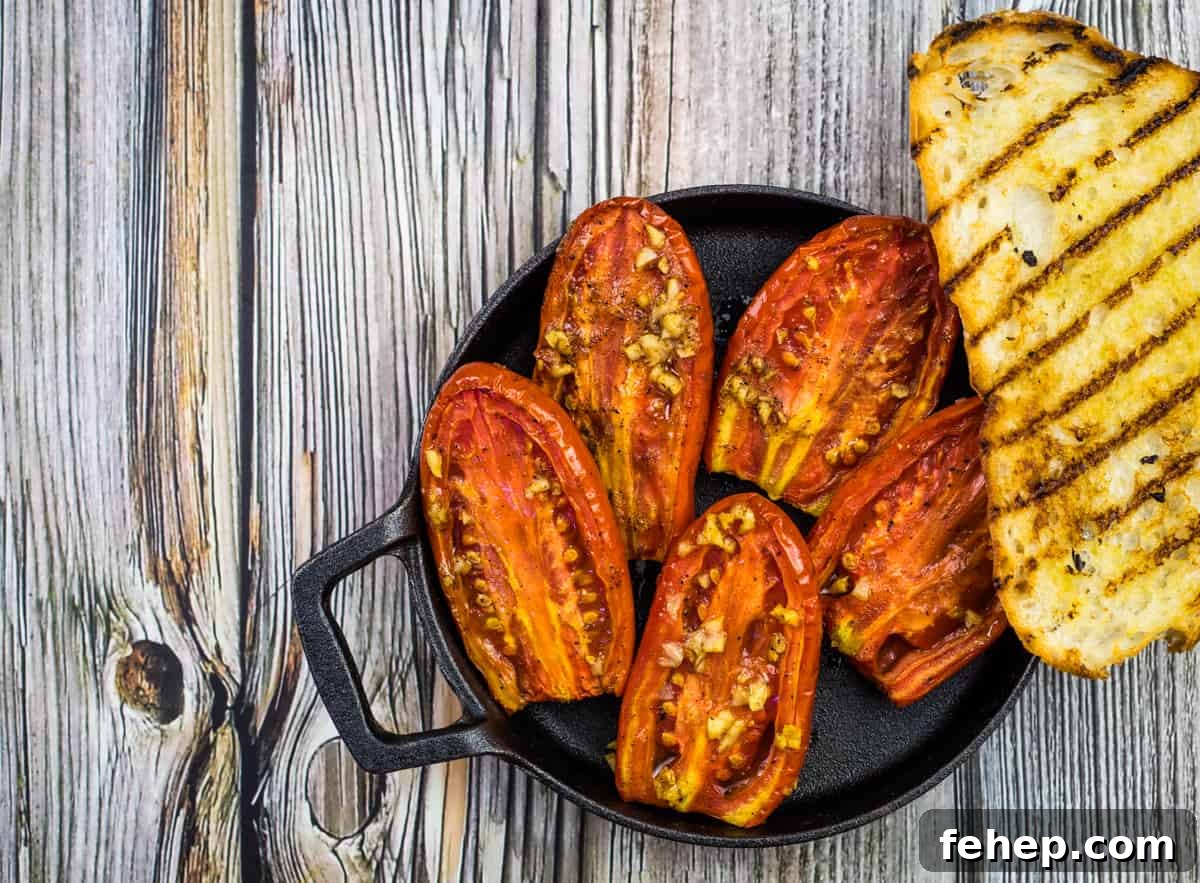 Smoked tomatoes in a dish with grilled bread.