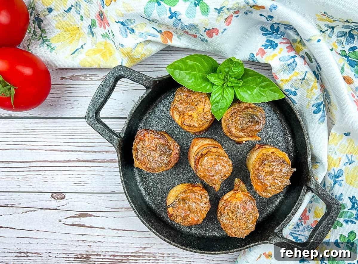 Smoked pork shots in a skillet with basil and tomatoes.