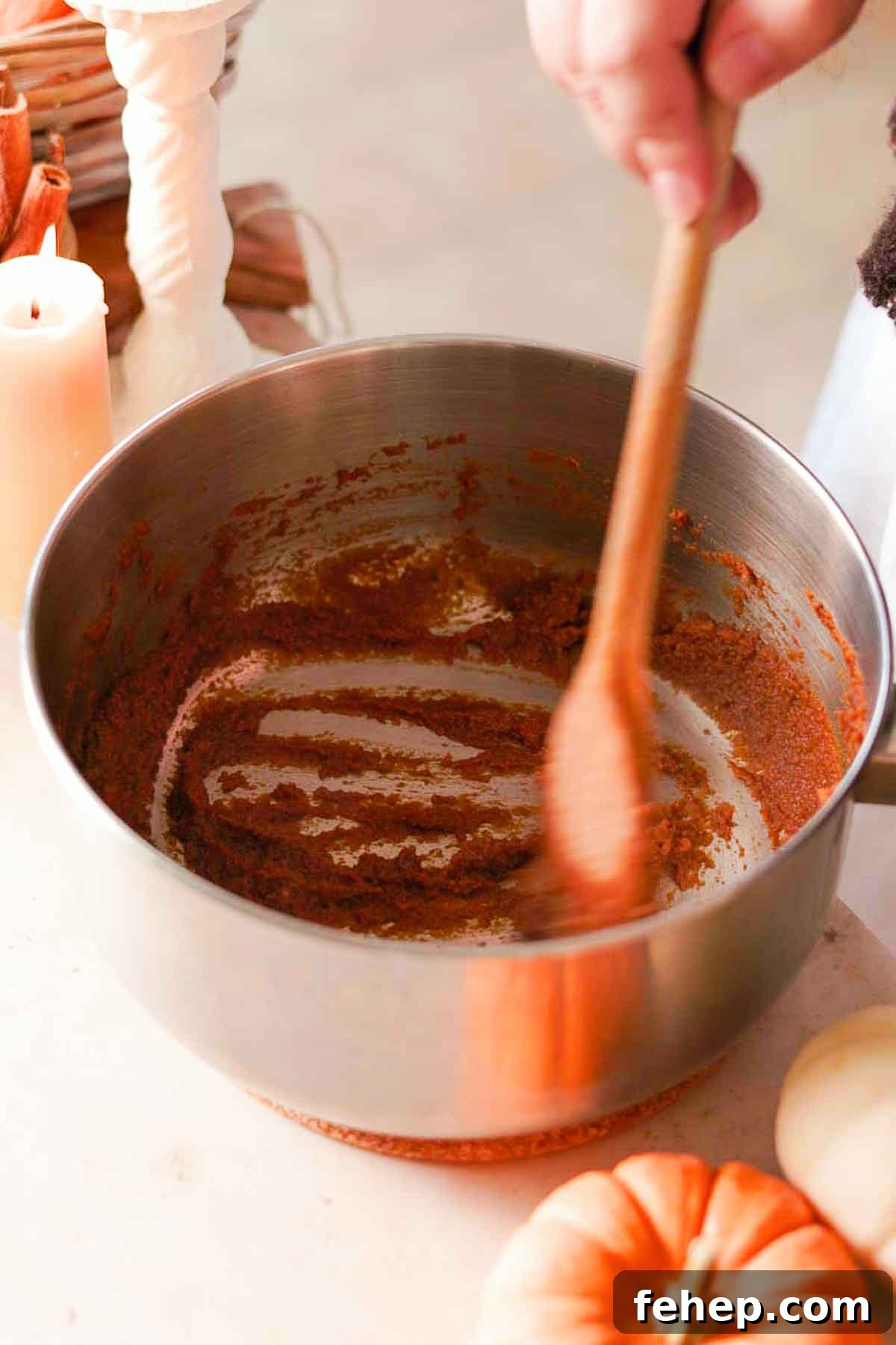 Pumpkin Spice Chai Latte Recipe: Cozy Fall Coffeehouse Drink 4 toasting pumpkin puree with spices in medium saucepan