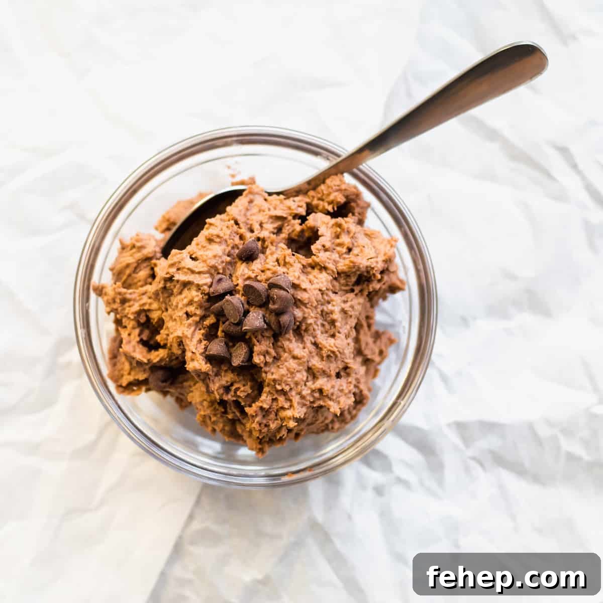 chocolate mousse in a mason jar with a spoon.