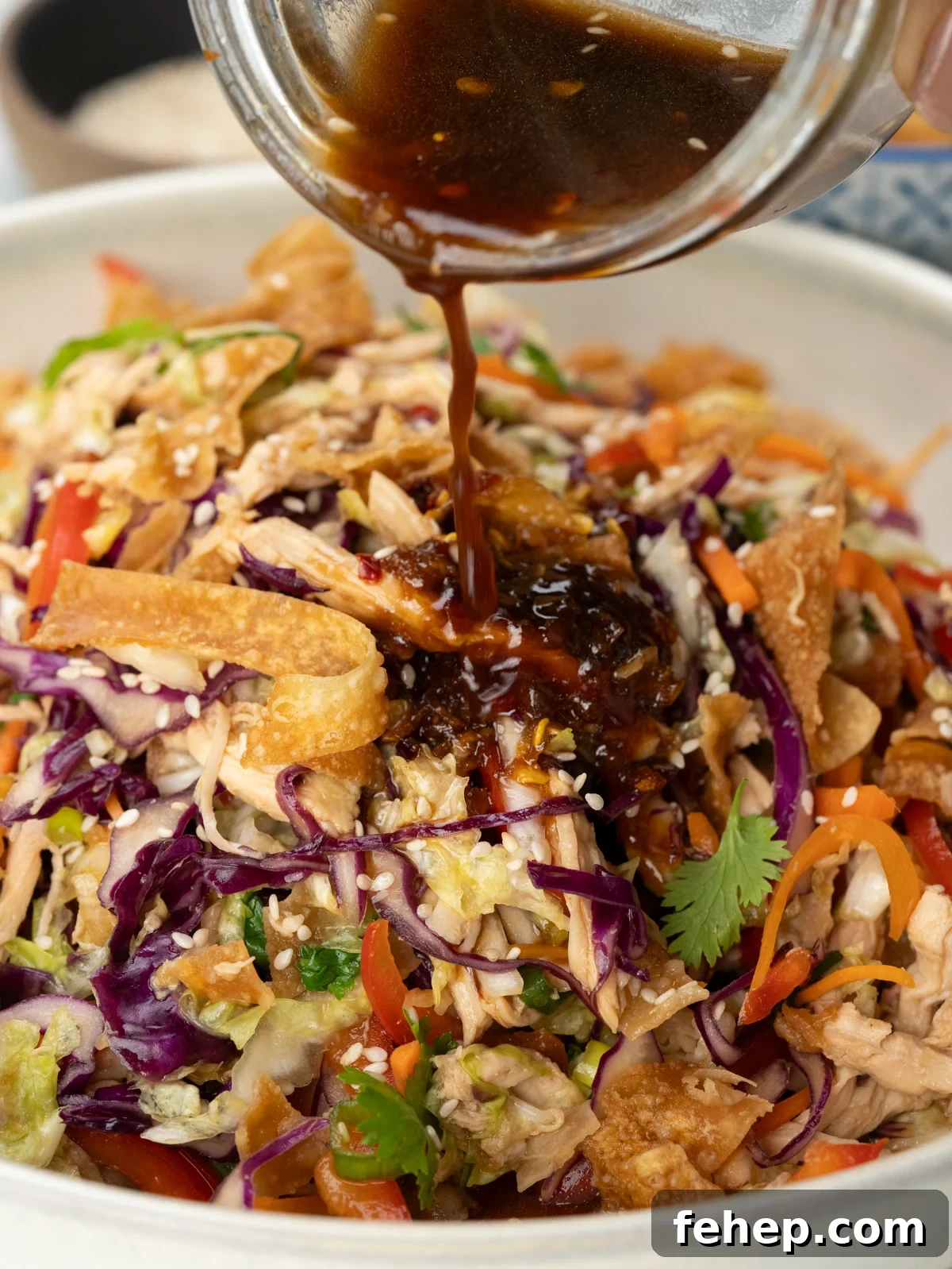 Drizzle Sesame dressing on tossed Chinese Chicken Salad. 