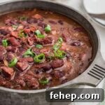 A pot of red beans and rice with ham hocks, cropped square.