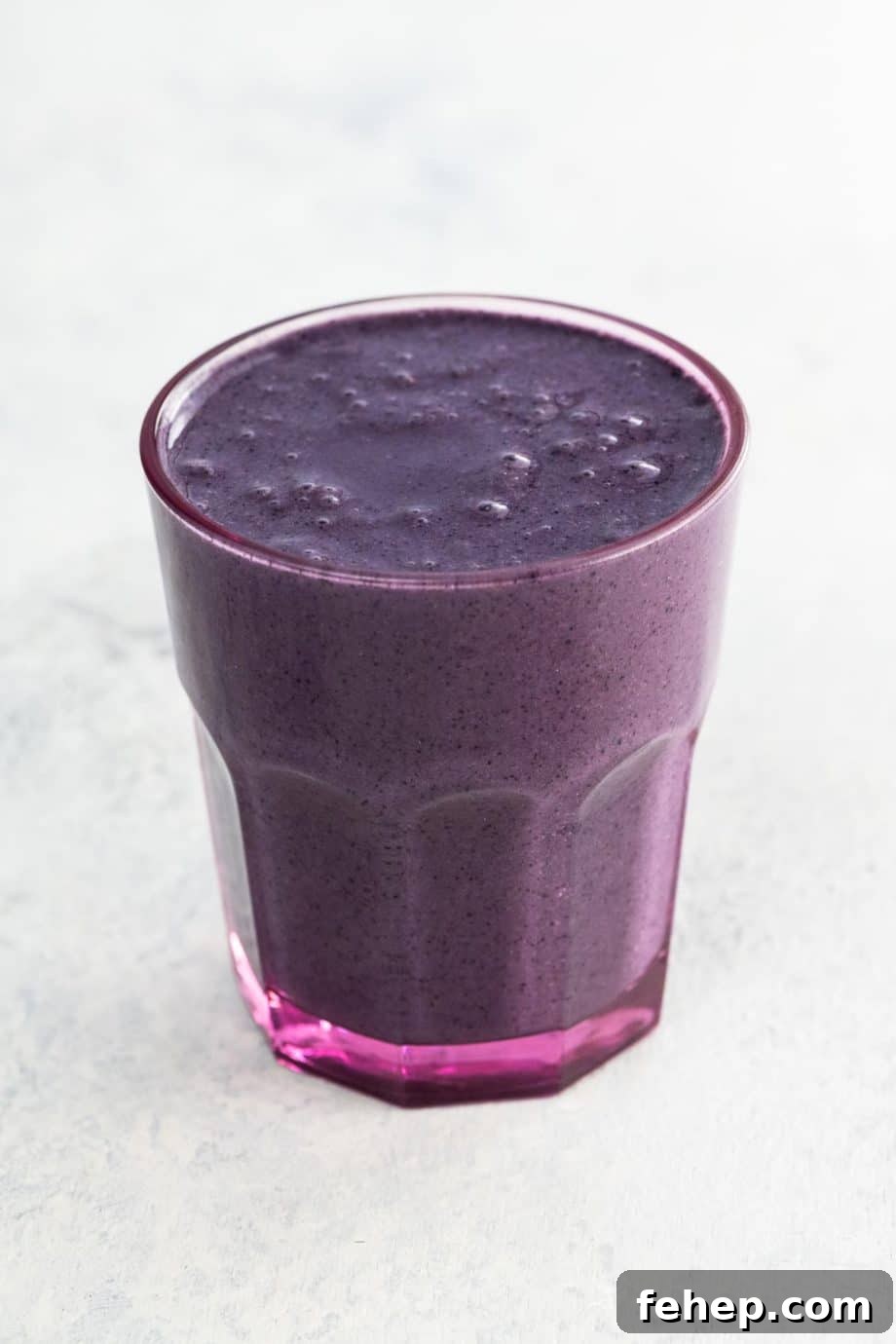 superfood smoothie with blueberries in a glass
