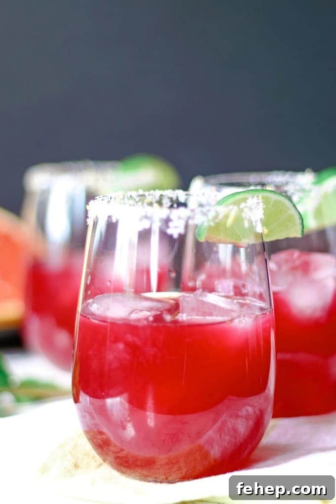 three grapefruit hibiscus margaritas