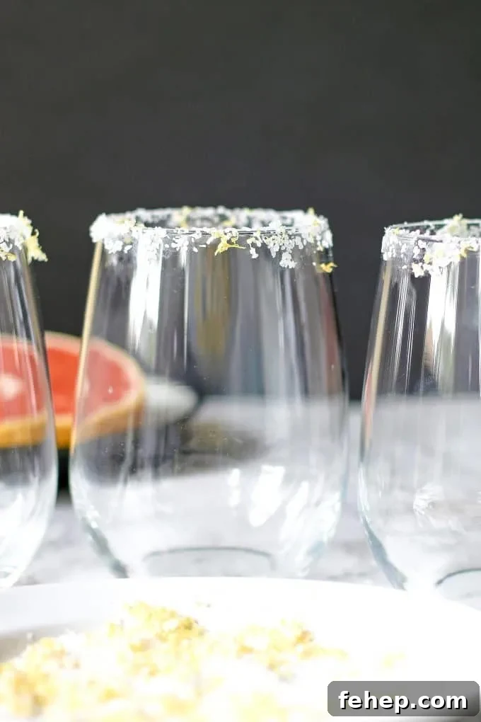 3 glasses rimmed in citrus margarita salt