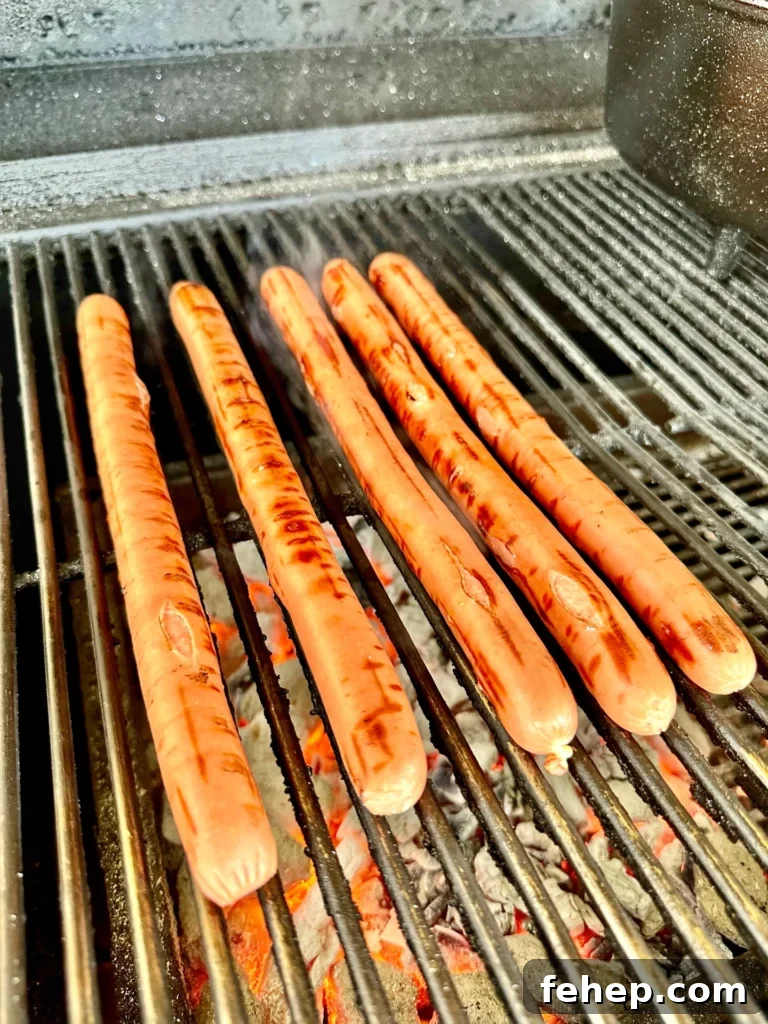 hot dogs on the grill