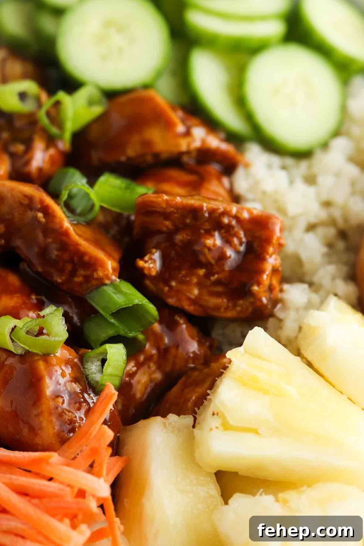 Marinated chicken, green onions, cucumbers, cauliflower rice and carrots all tossed together.