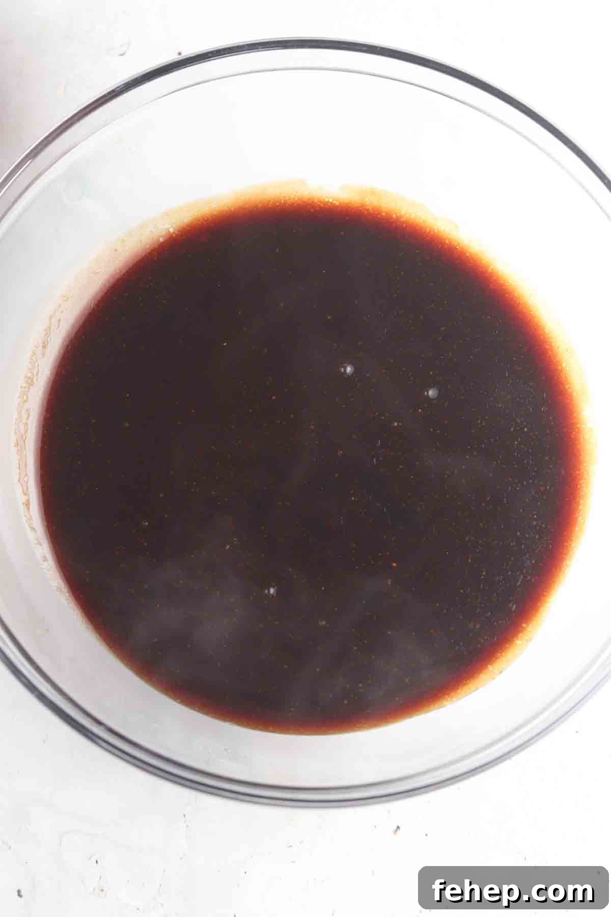 Chicken poke marinate in a large bowl.