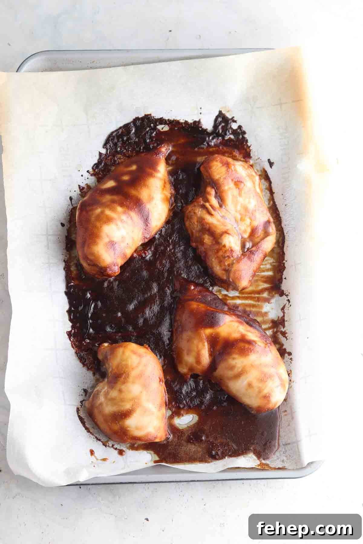 Marinate chicken on a sheet pan.
