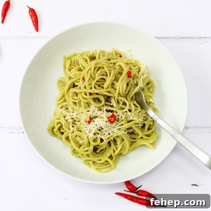 Avocado spaghetti with chilli and lemon juice topped with a little parmesan