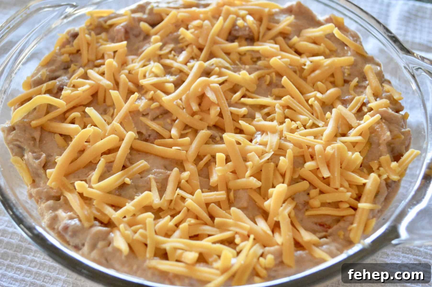 cheese sprinkled on top of beans