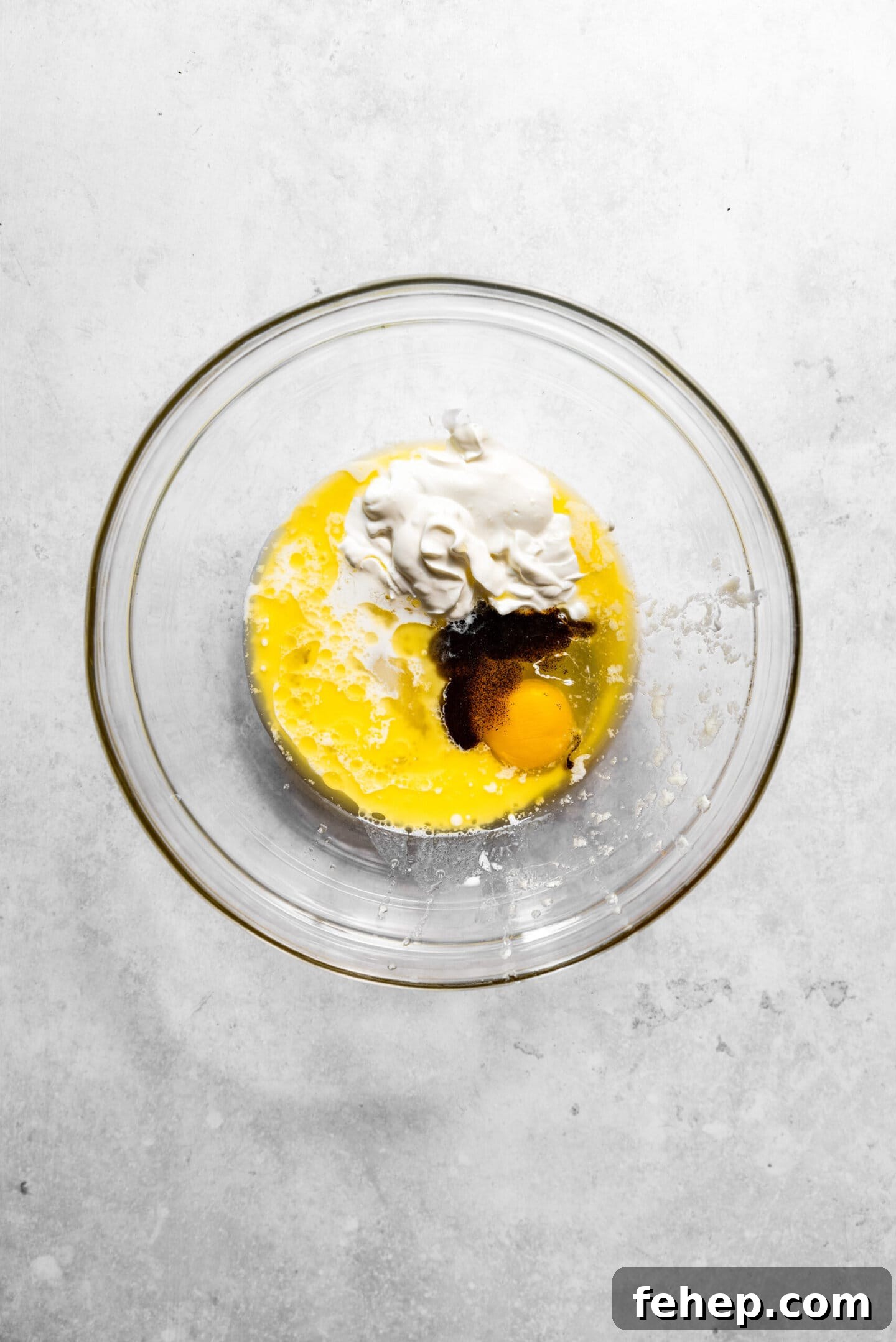 Butter, sugar, egg, vanilla, sour cream, and milk in a mixing bowl.