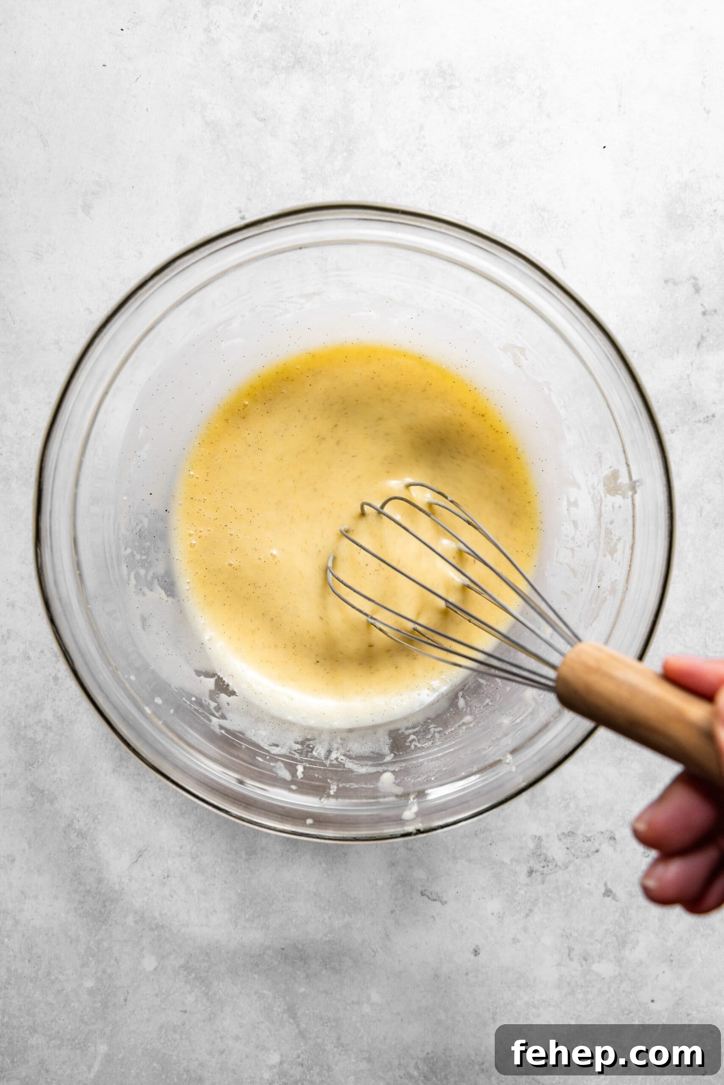Wet ingredients being whisked together