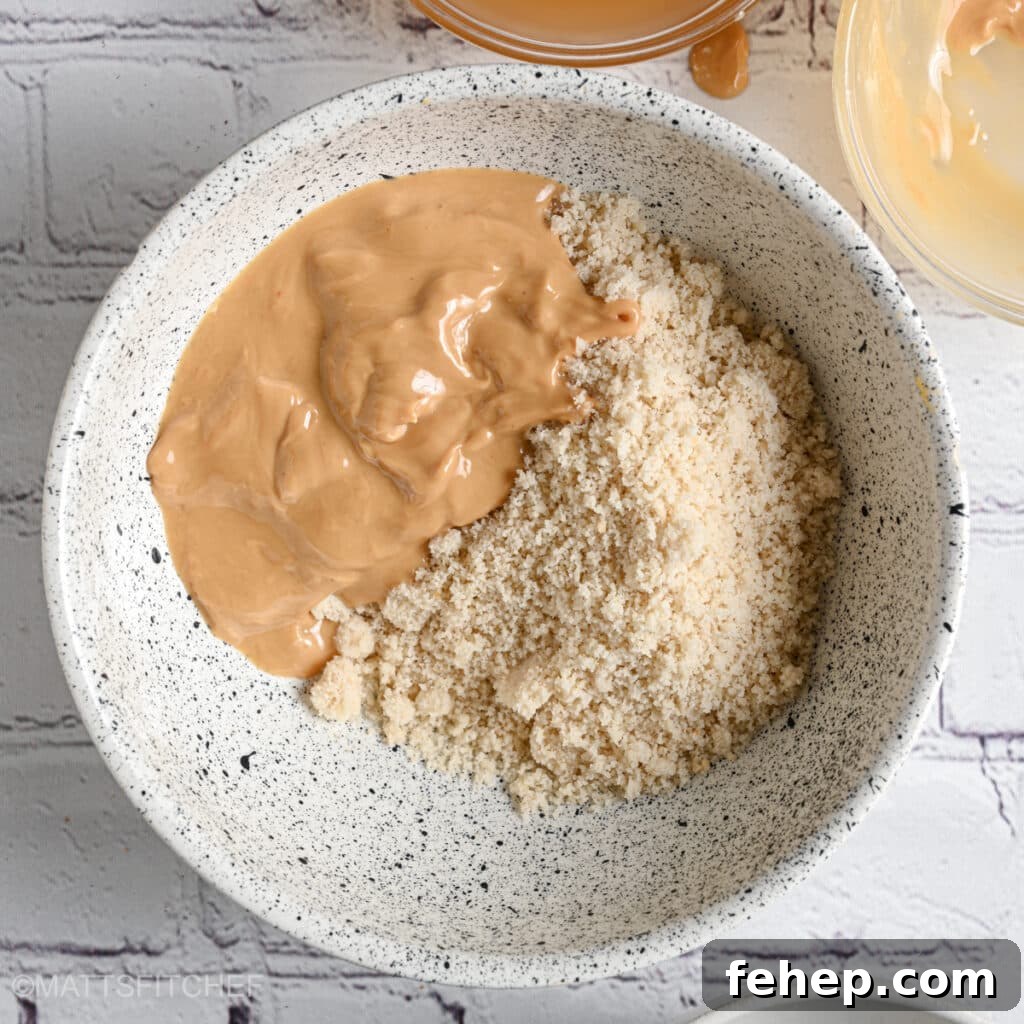 Protein powder with nut butter mixed in bowl