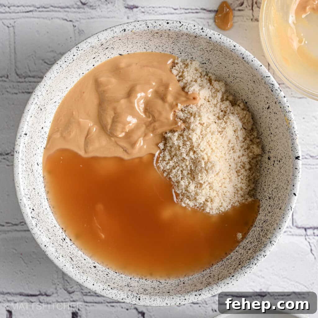 Adding maple syrup to protein powder and peanut butter