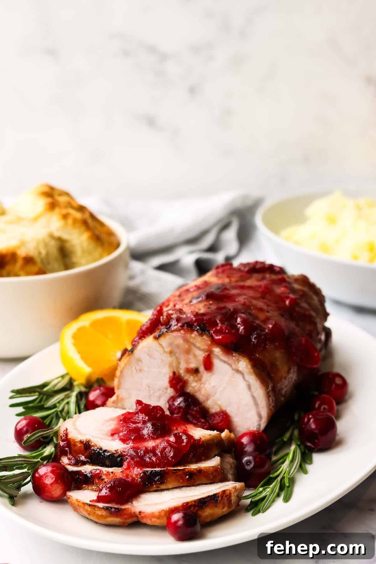cranberry glazed pork loin served on a platter