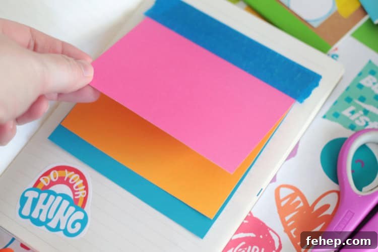 colored cards taped into book