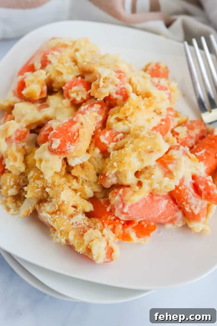 Carrot Casserole served on stacked white plates.