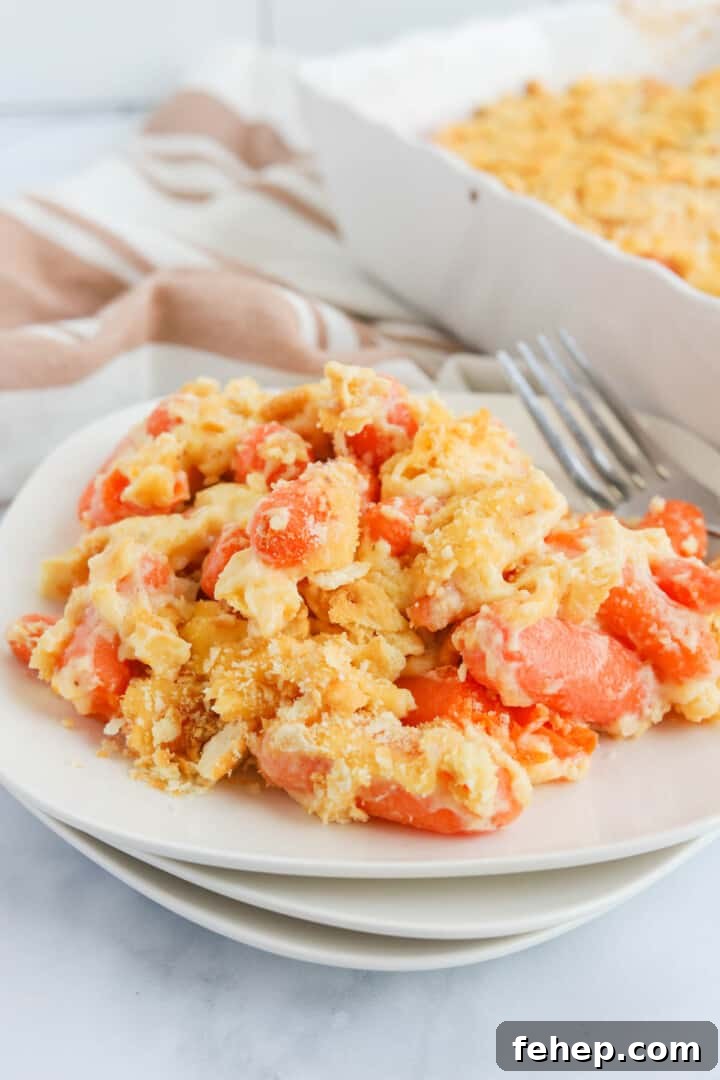baked carrot casserole on white plates.