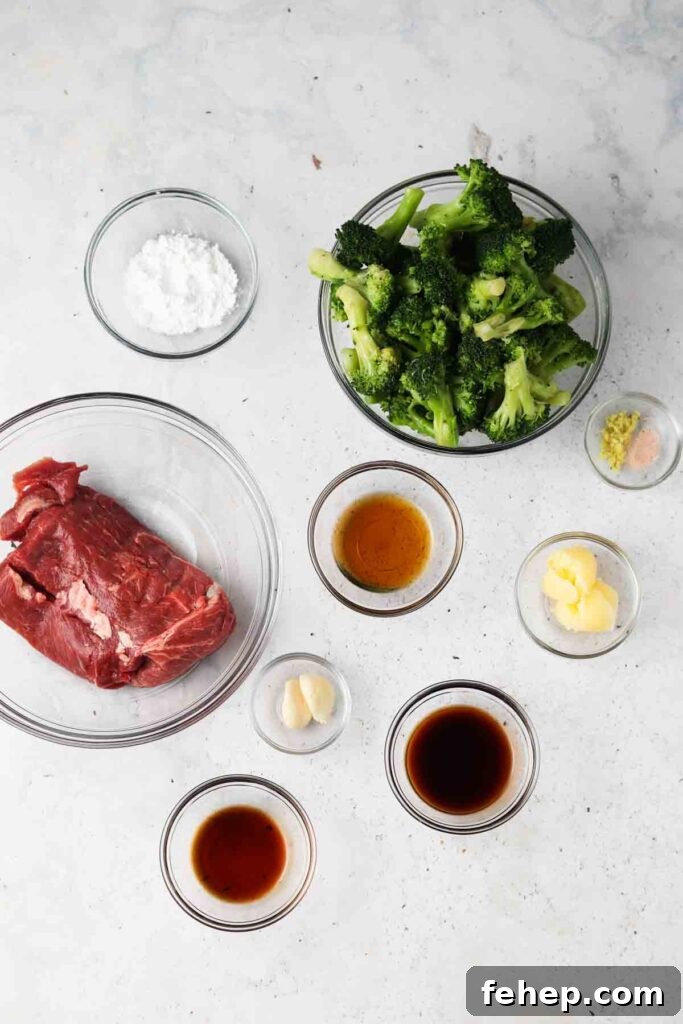 beef, broccoli, and other ingredients laid out in bowls